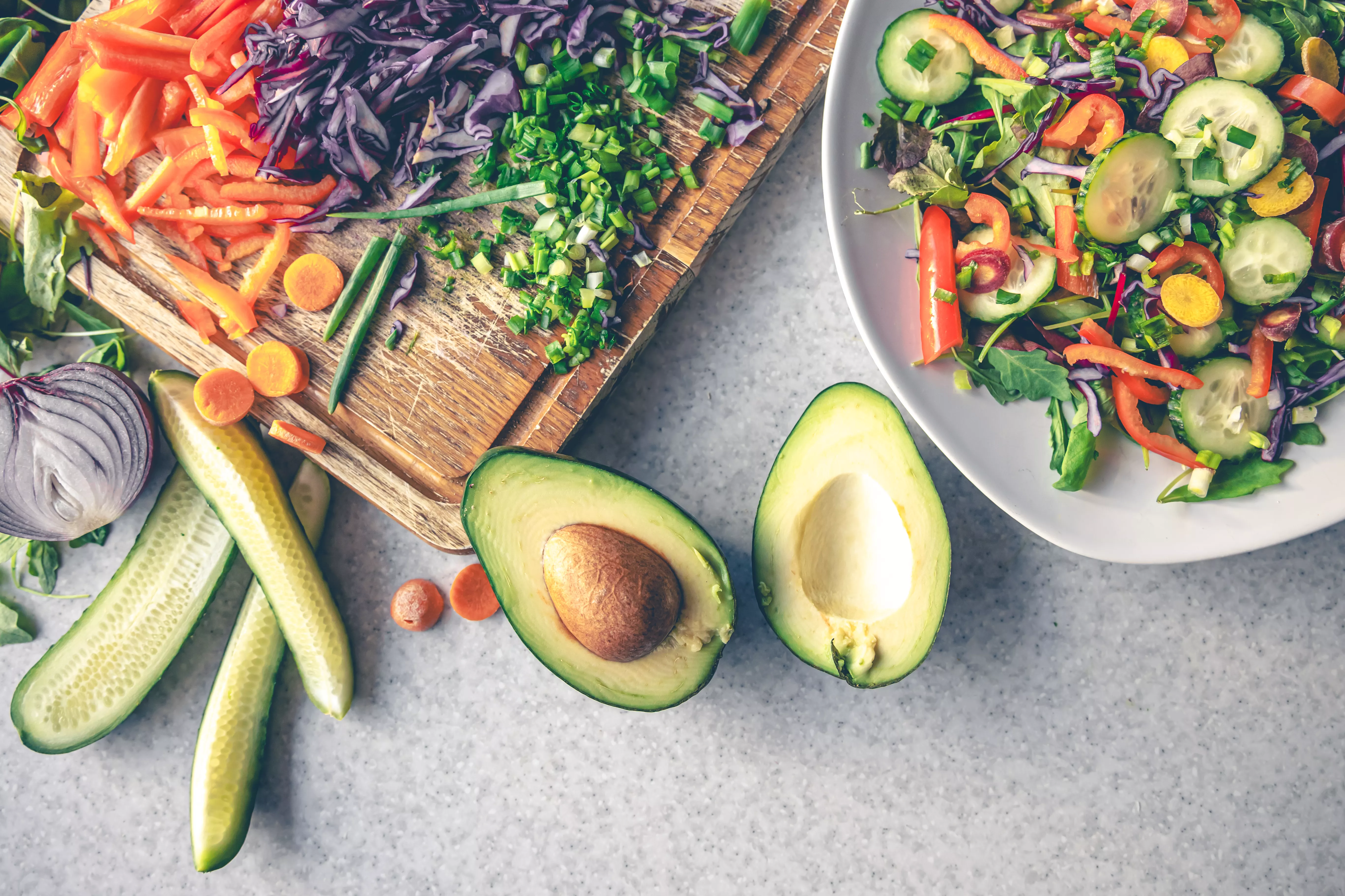 sliced-fresh-vegetables-cutting-board-kitchen-table-top-view.jpg
